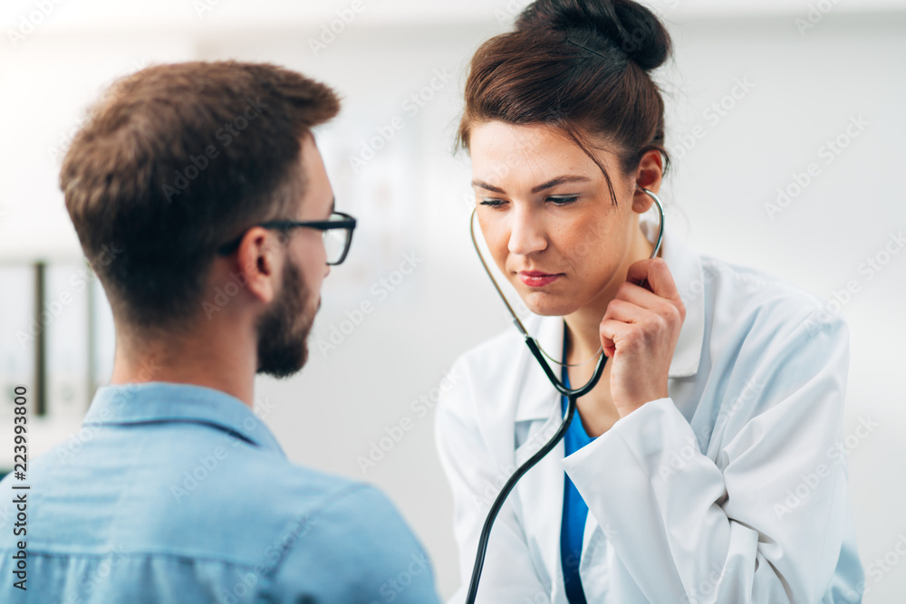 Woman Doctor Performing Stethoscope Check Up Woman Doctor Performing Stethoscope Check Up