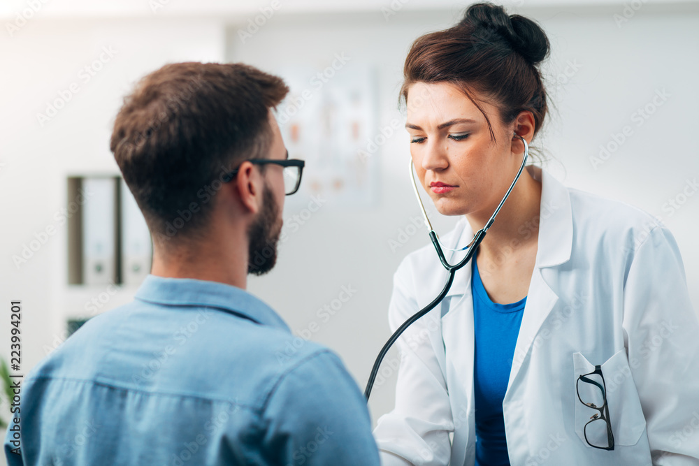 Woman Doctor Performing Stethoscope Check Up Woman Doctor Performing Stethoscope Check Up