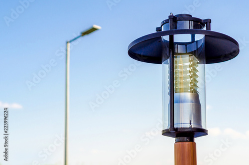 Street lamp on pillar on blue sky background