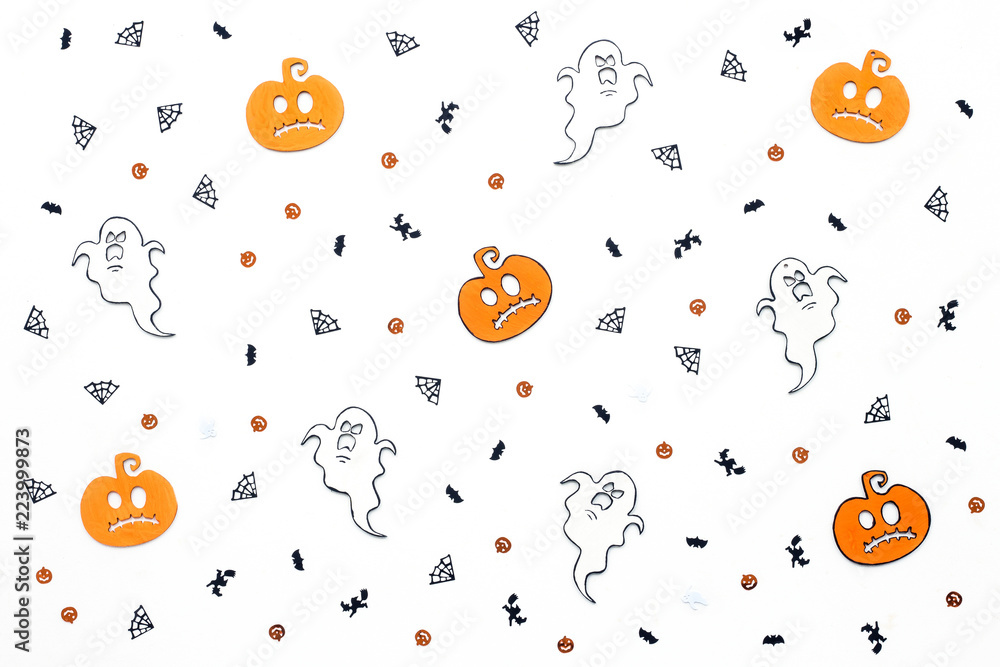 Halloween decorations on white background, flat lay, top view Halloween decorations on white background, flat lay, top view