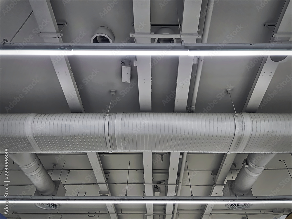 Low Angle View of Air Conditioning Ducts and Piping with Illumination