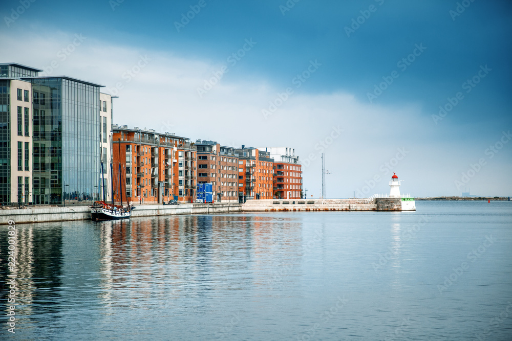 Cityscape of harbour and lighthouse in Malmo, Sweden, modern city urban landscape