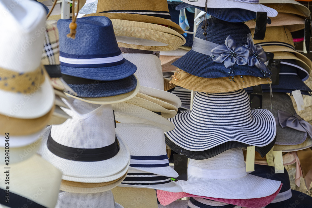 pile of hats in a store, colorful hats background.