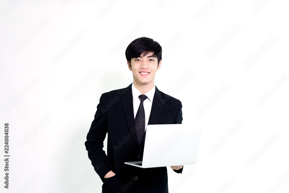 Asian business handsome man has holding laptop for woking with happy and relaxing isolated on white background. Asian business handsome man has holding laptop for woking with happy and relaxing isolated on white background.