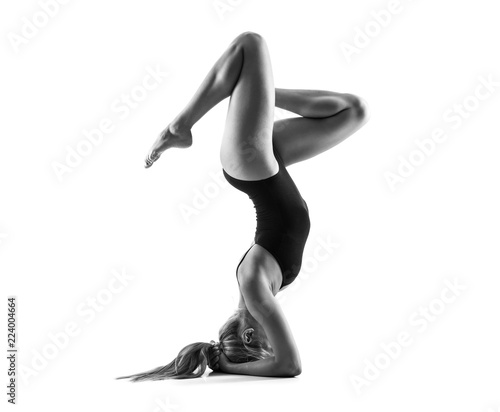 Young blonde woman in maillot practicing yoga lesson