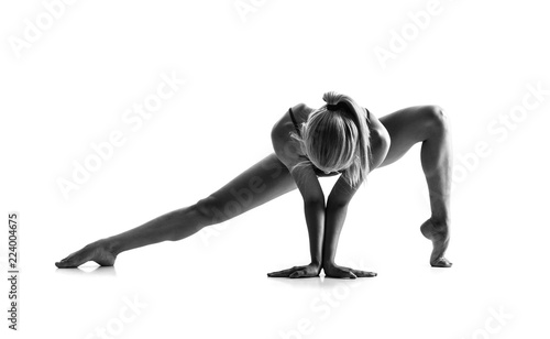 Fototapeta Naklejka Na Ścianę i Meble -  Young blonde woman in maillot practicing yoga lesson