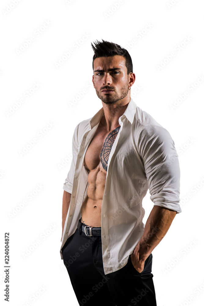 Elegant muscular attractive young man with white shirt open on naked torso,  isolated against white wall foto de Stock | Adobe Stock