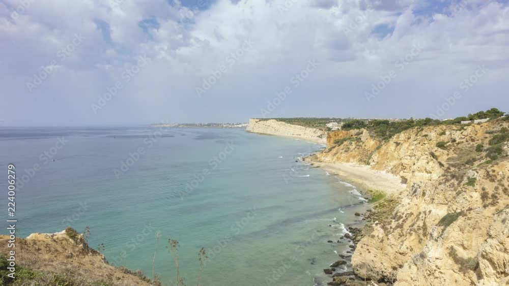 Timelapse - Moving clouds over Praia do Canavial, Algarve, Portugal Timelapse - Moving clouds over Praia do Canavial, Algarve, Portugal