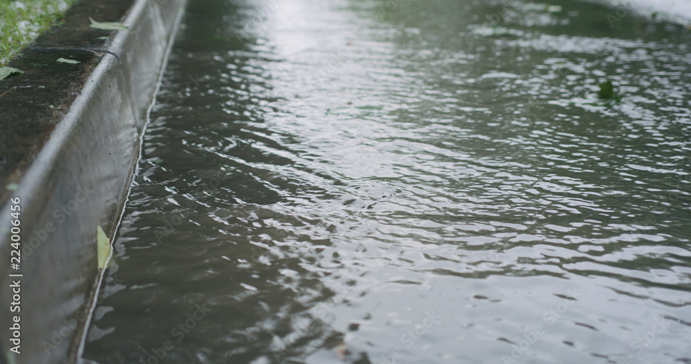 Obraz premium water streams on the street after rain