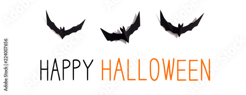 Happy Halloween message with paper bats overhead view on a solid color