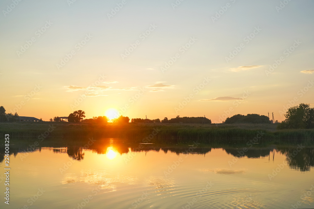 Beautiful summer sunset on small lake