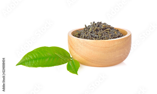 Fresh and dried green tea leaves on white background