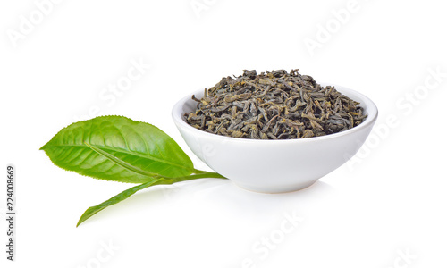 Fresh and dried green tea leaves on white background