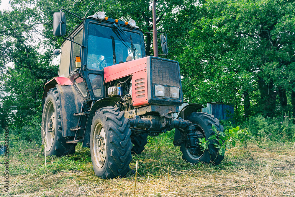 Tractor for working in the field and mowing grass Tractor for working in the field and mowing grass