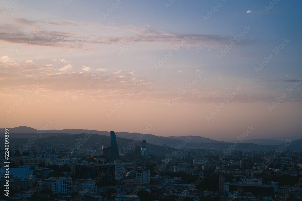 view of city Tbilisi at sunset