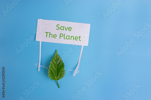 Heal the world - environment protection.leaf holding a banner photo