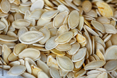 white Raw pumpkin seeds background