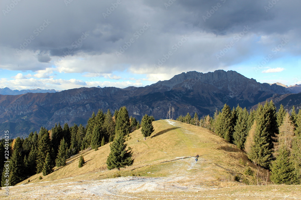 Fototapeta premium Presolana, monte Pora, Orobie alps. View of Presolana mountains from monte Pora with the first artificial snow of the winter season.