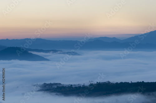 Sunrise in Northern Thailand with a misty landscape and hills