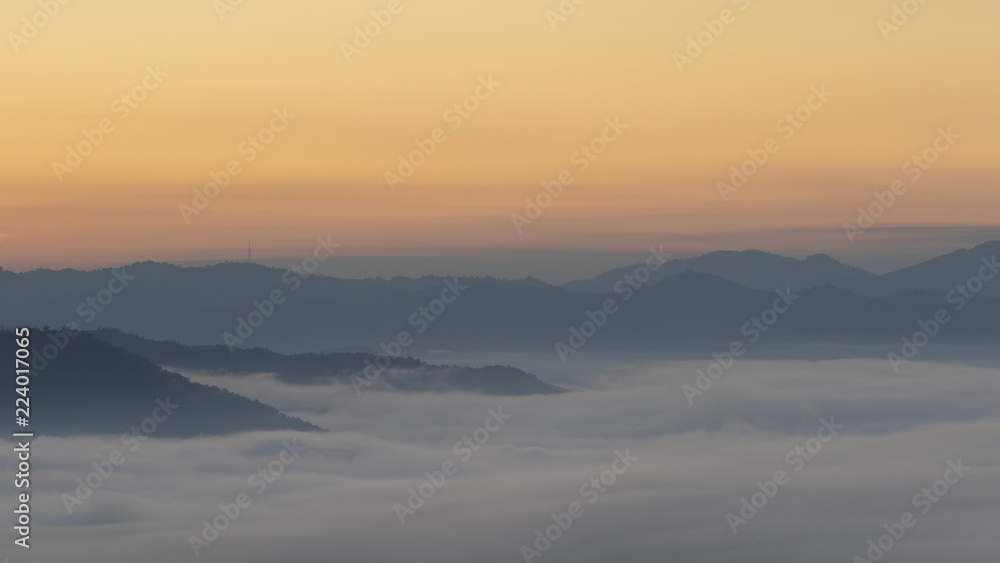 Sunrise in Northern Thailand with a misty landscape and hills Sunrise in Northern Thailand with a misty landscape and hills