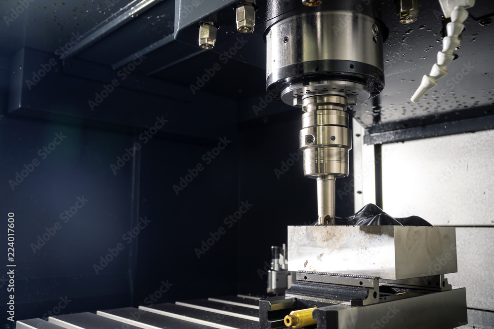The CNC milling machine cutting the mold part with the index-able ball end mill .The hi-Technology manufacturing process. The CNC milling machine cutting the mold part with the index-able ball end mill .The hi-Technology manufacturing process.