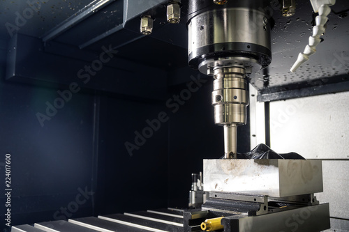 The CNC milling machine cutting the mold part with the index-able ball end mill .The hi-Technology manufacturing process.