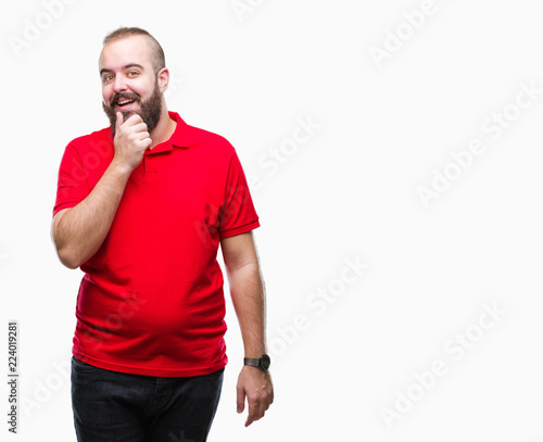 Young caucasian hipster man wearing red shirt over isolated background looking confident at the camera with smile with crossed arms and hand raised on chin. Thinking positive.