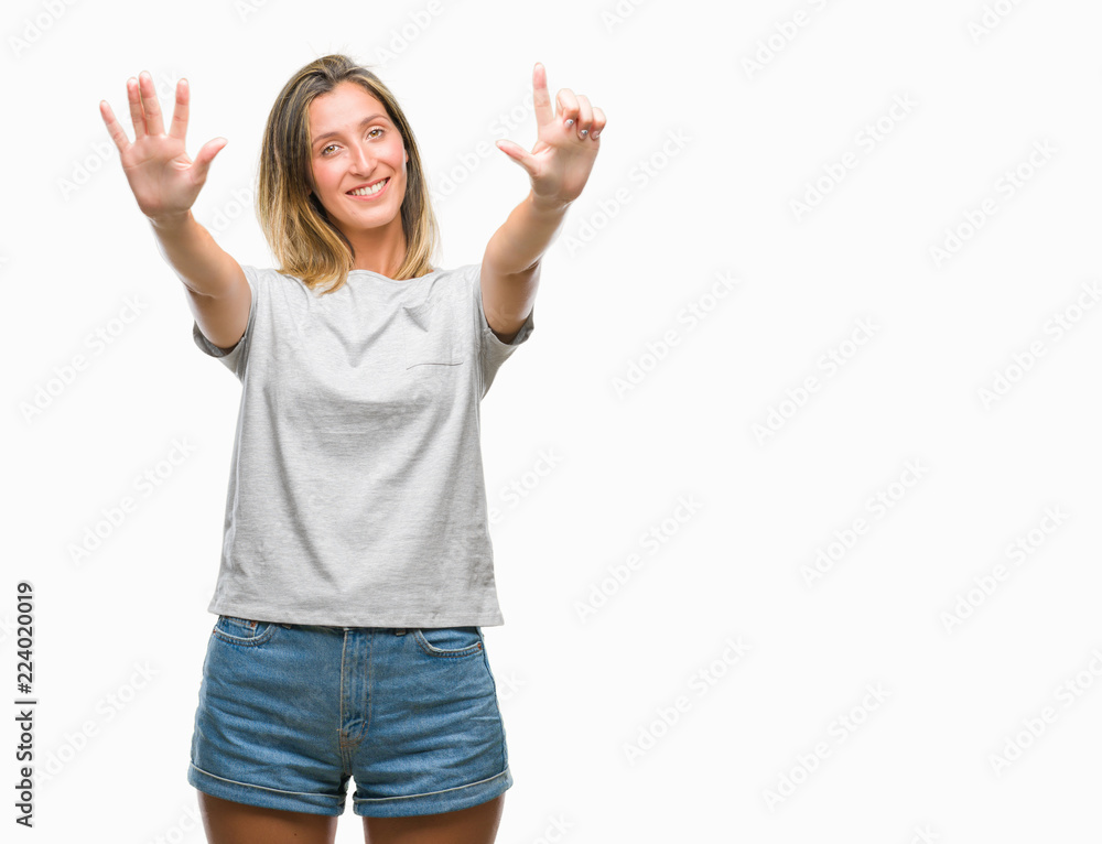 Young beautiful woman over isolated background showing and pointing up with fingers number seven while smiling confident and happy. Young beautiful woman over isolated background showing and pointing up with fingers number seven while smiling confident and happy.