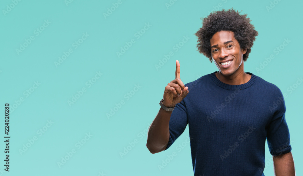 Afro american man over isolated background pointing finger up with successful idea. Exited and happy. Number one. Afro american man over isolated background pointing finger up with successful idea. Exited and happy. Number one.