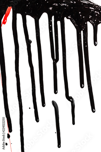 Thick black paint isolated on a white background. Paint flows