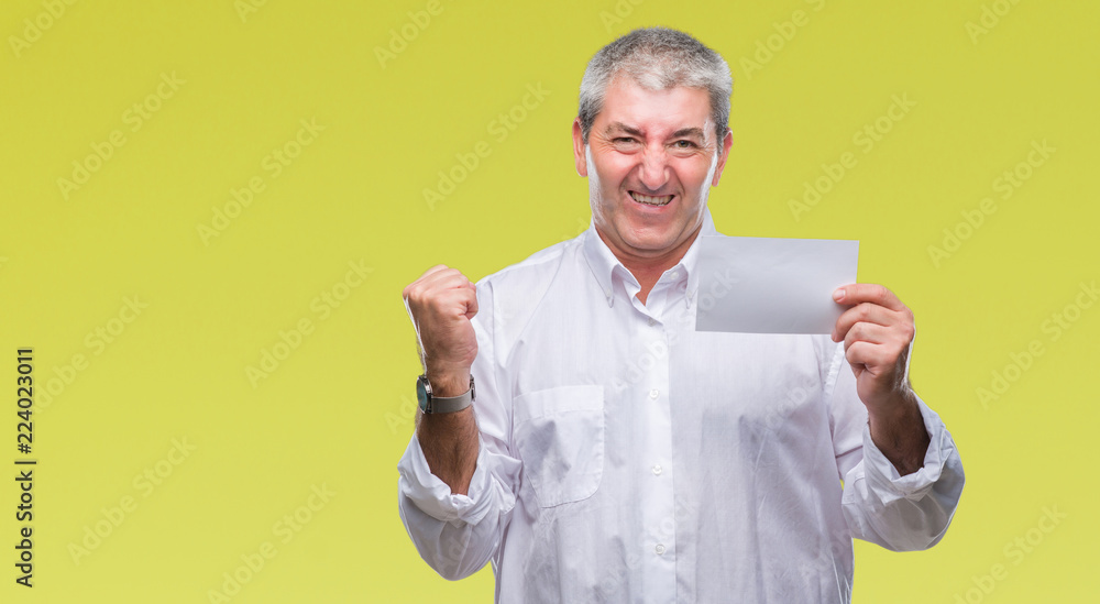 Handsome senior man holding blank card over isolated background screaming proud and celebrating victory and success very excited, cheering emotion Handsome senior man holding blank card over isolated background screaming proud and celebrating victory and success very excited, cheering emotion