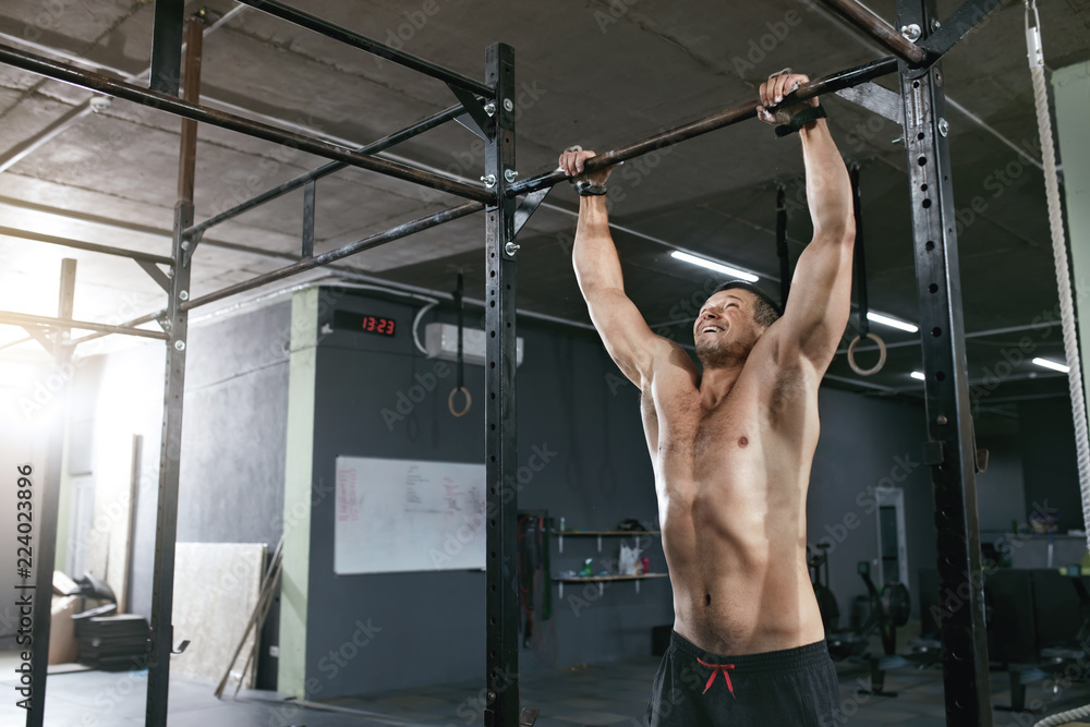 Training. Sports Man Doing Pull Ups Exercise On Sport Rack Training. Sports Man Doing Pull Ups Exercise On Sport Rack