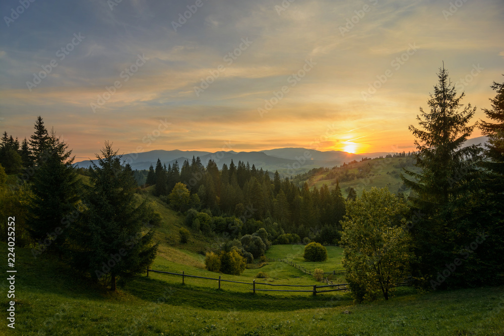 Sunset in the forest and mountains in the Ukrainian Carpathians Sunset in the forest and mountains in the Ukrainian Carpathians