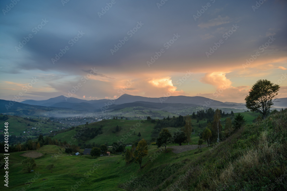 Sunset in the forest and mountains in the Ukrainian Carpathians