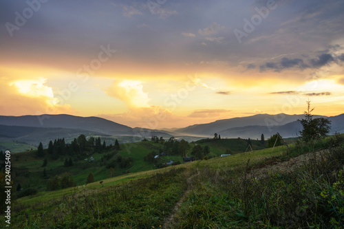 Sunset in the forest and mountains in the Ukrainian Carpathians