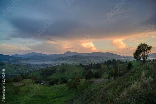 Sunset in the forest and mountains in the Ukrainian Carpathians