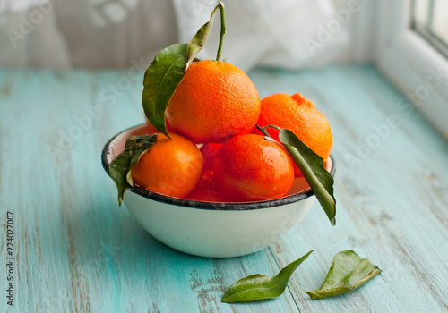 Mandarins and oranges on a wooden background. Citrus Fruit, Christmas atmosphere