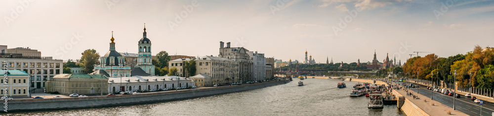 Panorama of Moscow river with boats and embankment and view on Kremlin on red Square