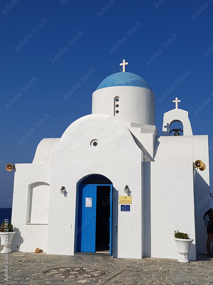 White Greek Church in blue clear sky