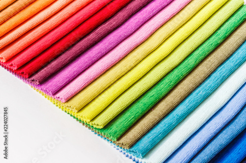 Sample collection of colorful fabrics on white background