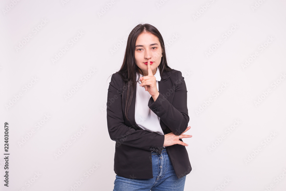 Portrait of beautiful asian woman making gesture hush on white background with copy space Portrait of beautiful asian woman making gesture hush on white background with copy space