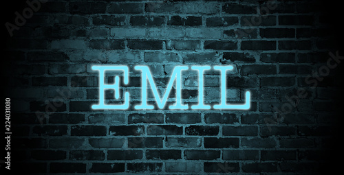 first name Emil in blue neon on brick wall