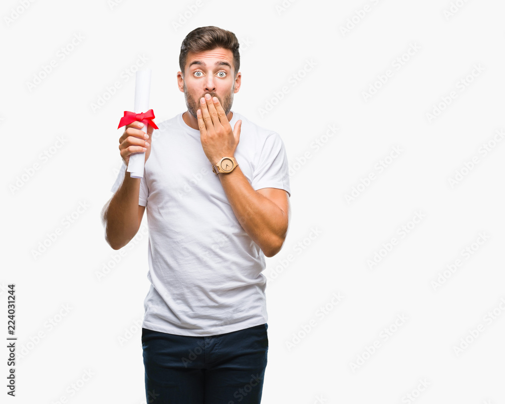 Young handsome man holding degree over isolated background cover mouth with hand shocked with shame for mistake, expression of fear, scared in silence, secret concept Young handsome man holding degree over isolated background cover mouth with hand shocked with shame for mistake, expression of fear, scared in silence, secret concept