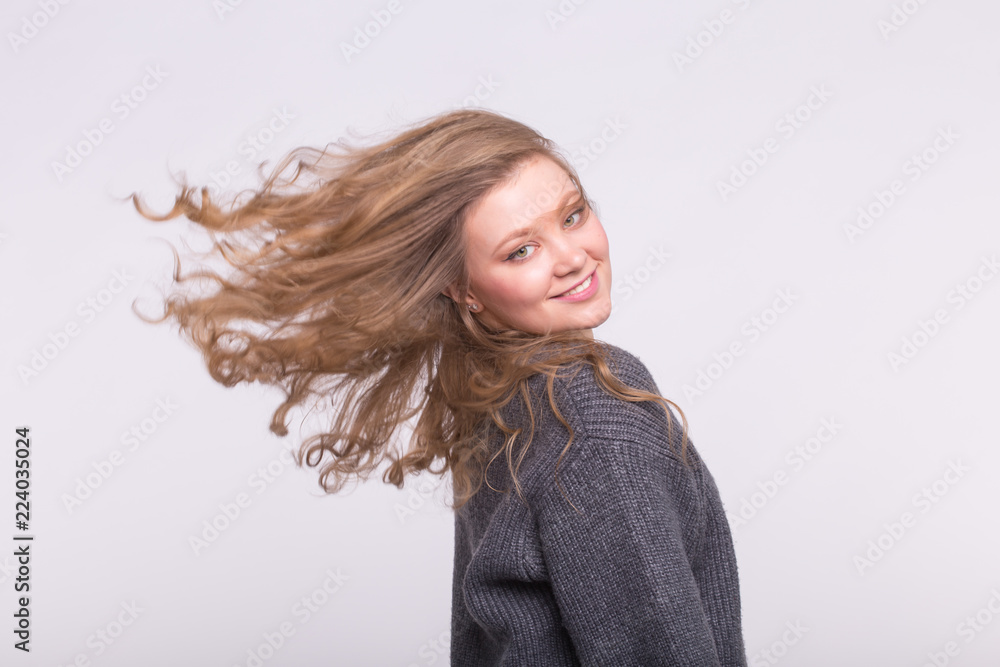 Naklejka premium Portrait of beautiful young woman with curly wave hair