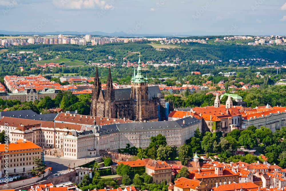 Aerial view of the city. St. Vitus Cathedral over old town red roofs. Prague, Czech Republic