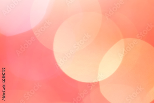 Light orange bokeh lights abstract background. Space for text.