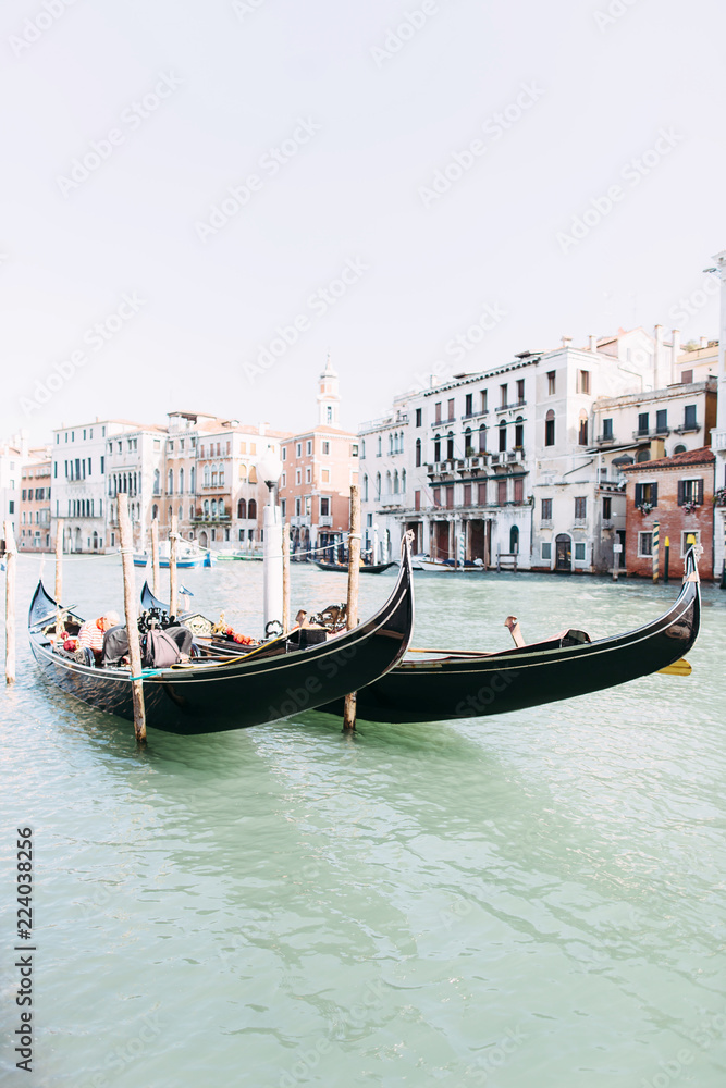 Beautiful view of the canal in Venice. Canal with Gondolas and boats, old buildings