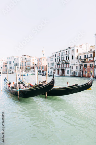 Beautiful view of the canal in Venice. Canal with Gondolas and boats, old buildings © sofiko14