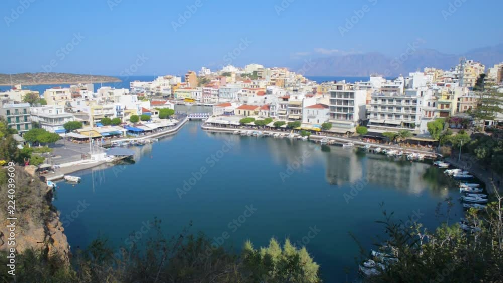 Agios Nikolaos village lake center, Mediterranean town, Crete Greece Agios Nikolaos village lake center, Mediterranean town, Crete Greece