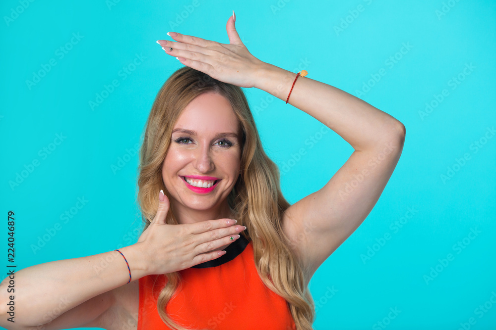 beautiful young girl with her hair on a blue background beautiful young girl with her hair on a blue background